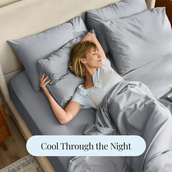 Woman sleeping peacefully on cool gray Miracle Made sheets - Cool Through the Night